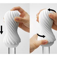 Load image into Gallery viewer, Mains tenant le masturbateur pénien blanc Flex de Tenga en démonstration sur un dildo en verre
