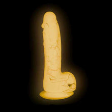 Charger l'image dans la galerie, Dildo en silicone rose marbré luminescent par Addiction illuminé sur fond noir