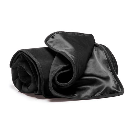 Couverture sexuelle noire en velours et polyester de Liberator sur fond blanc